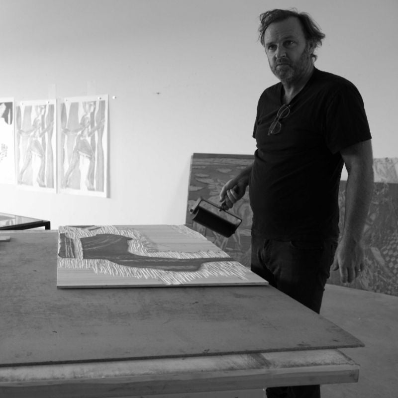 Picture of Daniel Clarke making a woodcut oeuvre for an art gallery