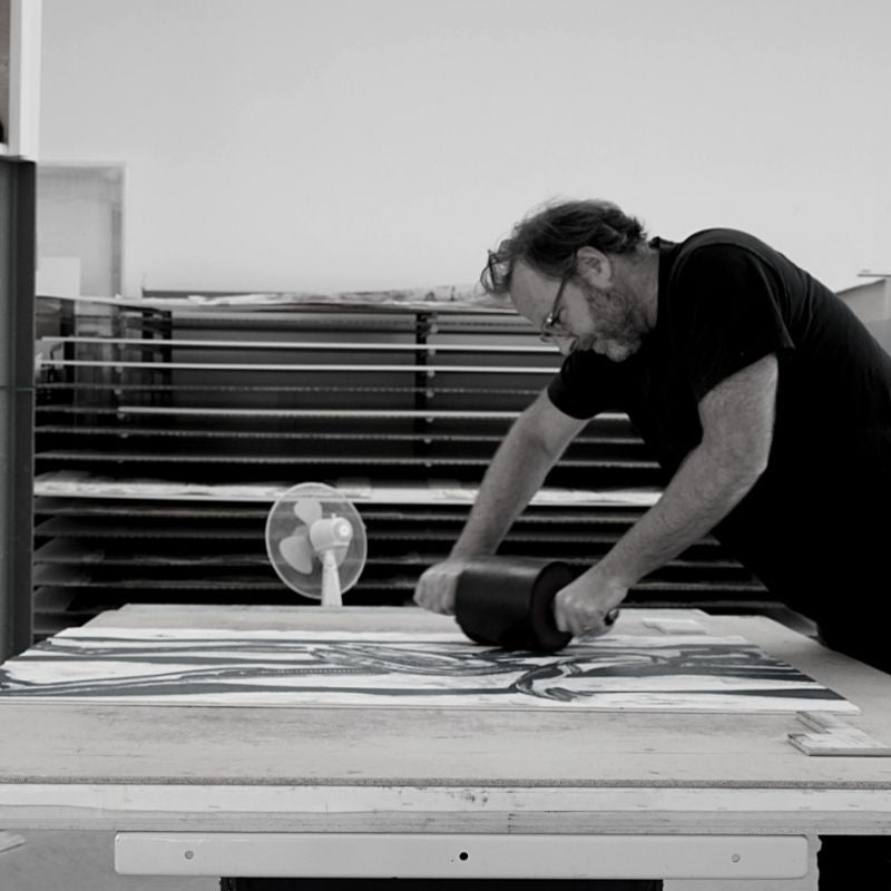 Picture of Daniel Clarke making a woodcut oeuvre for an art gallery